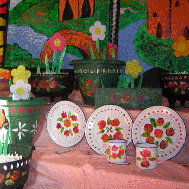 Still life of flowers and plates with flower painted on them